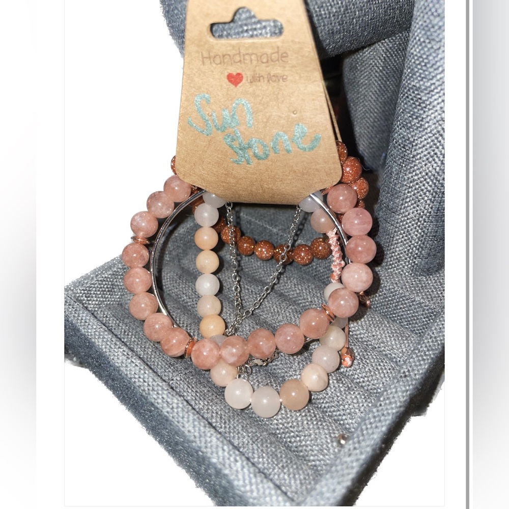 Stackable of 5 bracelets 2 silver & 3 beaded. 1 adjustable braided 2 stretch